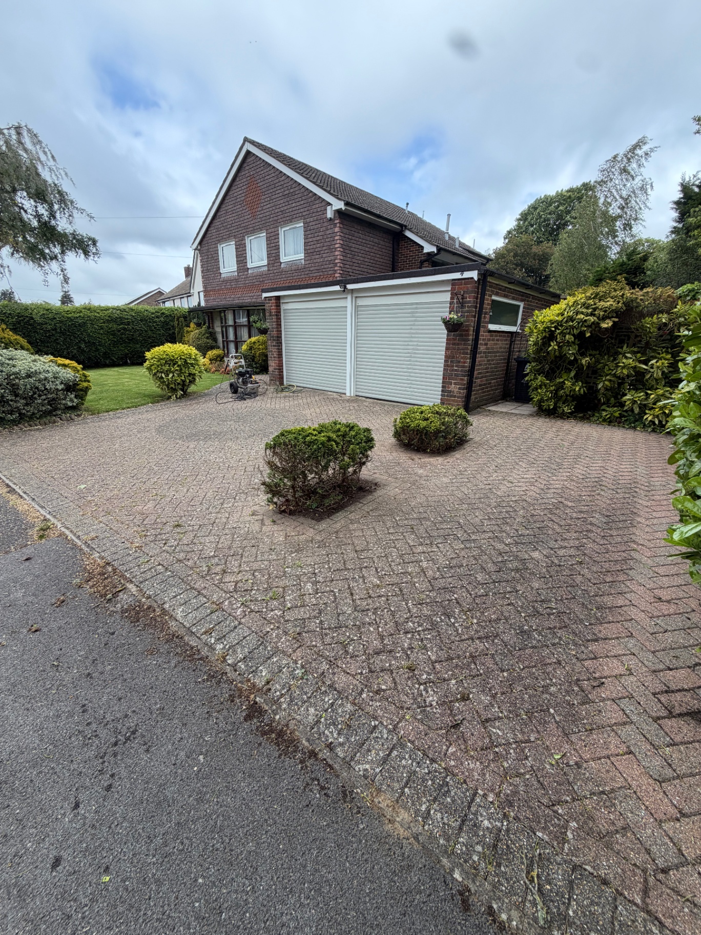 Red block paving driveway before cleaning