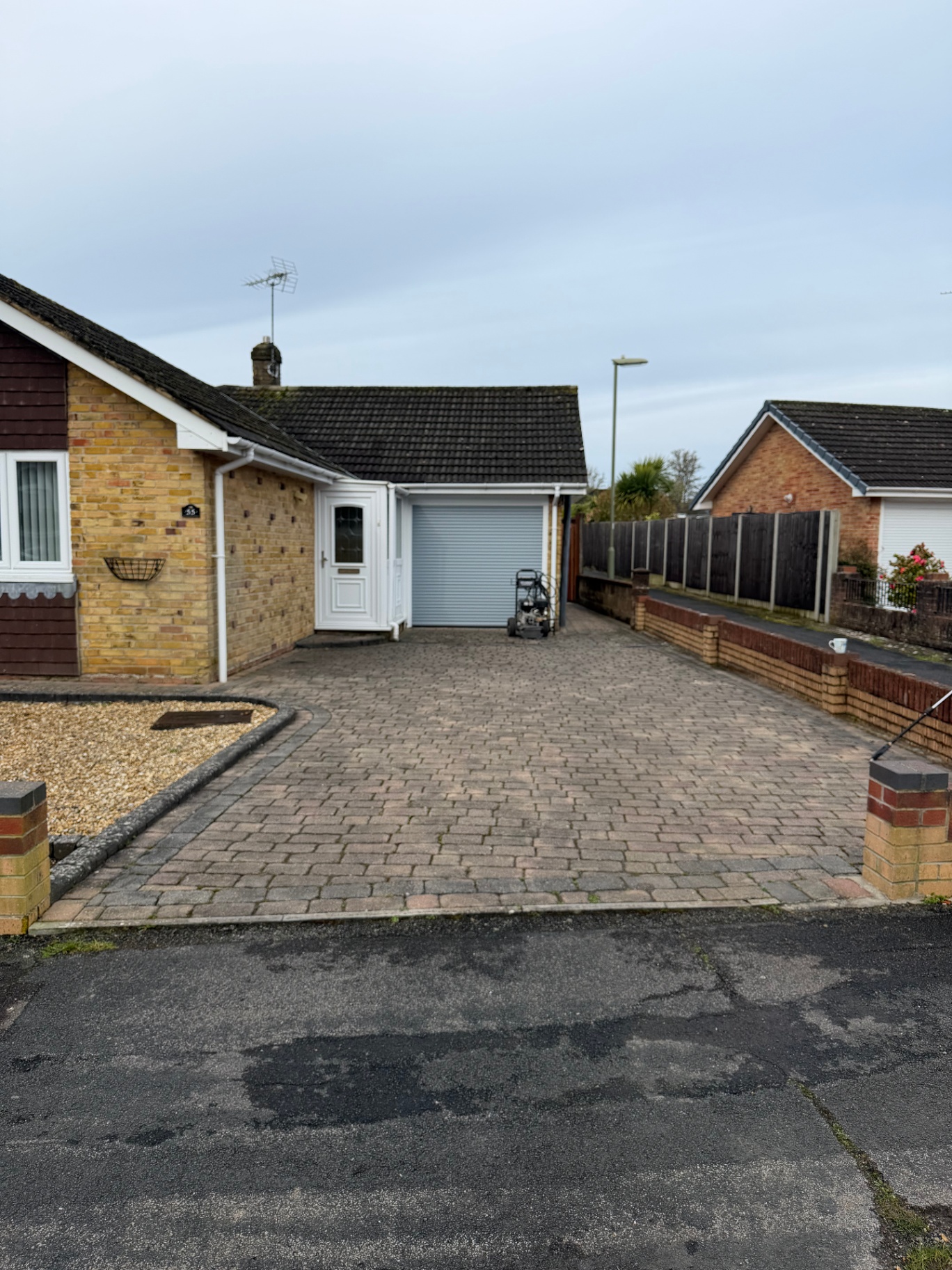 Bungalow block paving driveway before cleaning