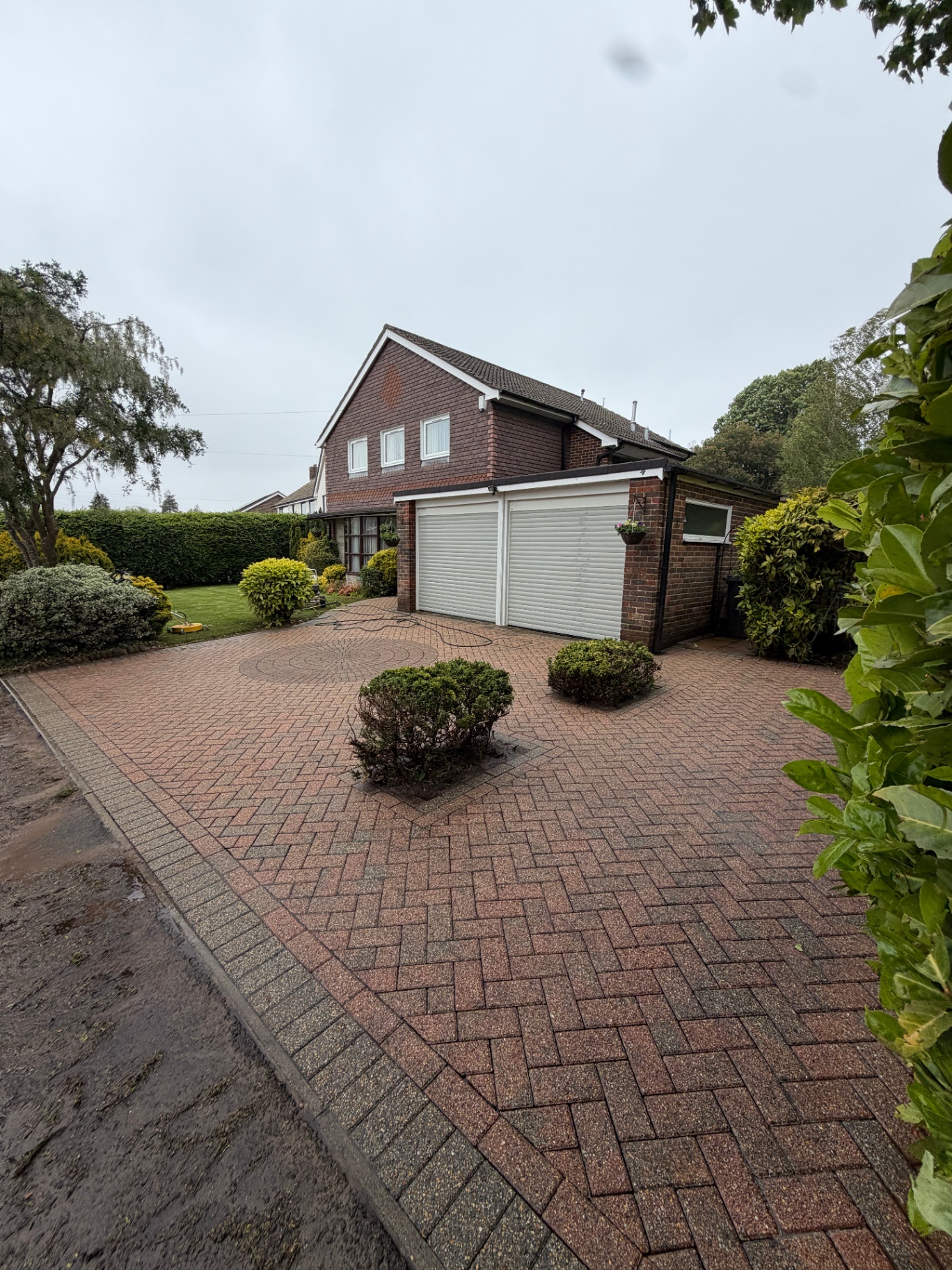 Red block paving driveway after cleaning